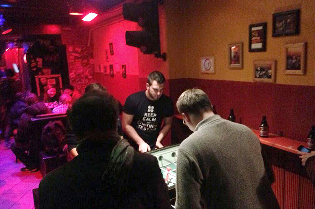 People playing table soccer after learner's meetup
